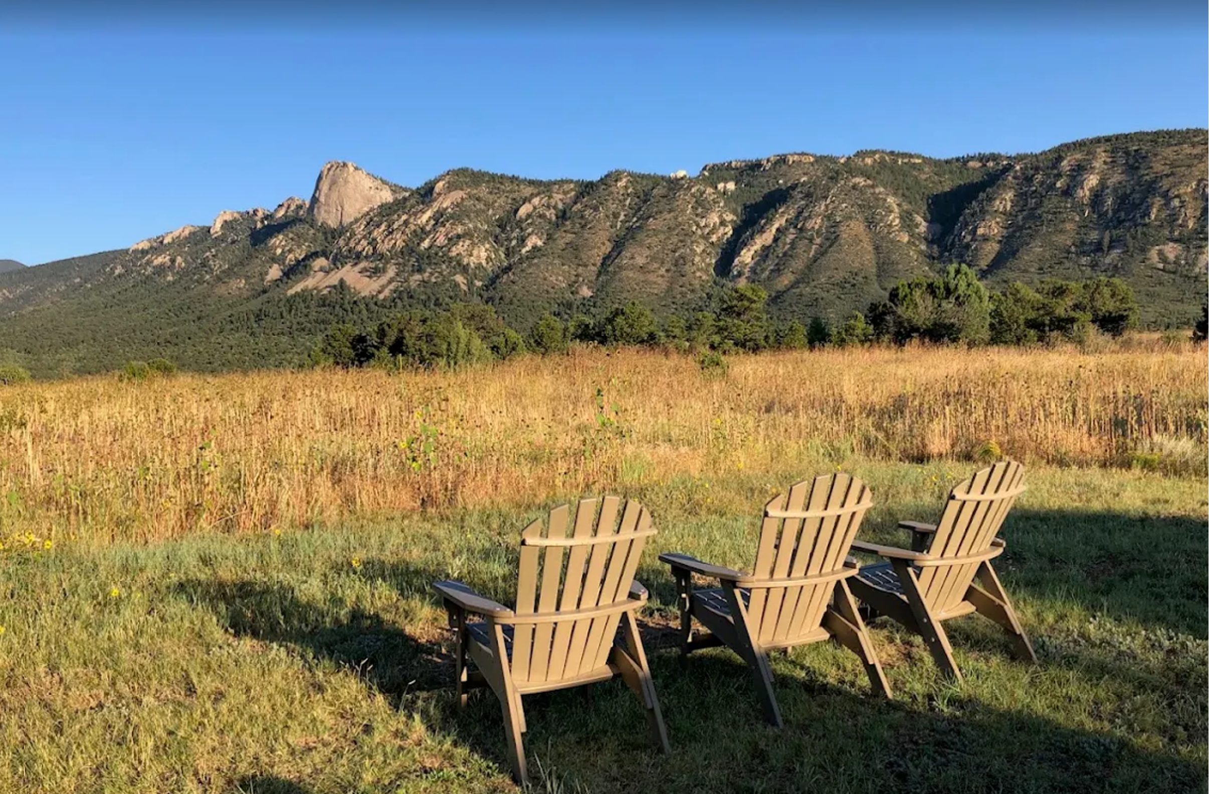 Two chairs waiting · golden hour · looking northwest